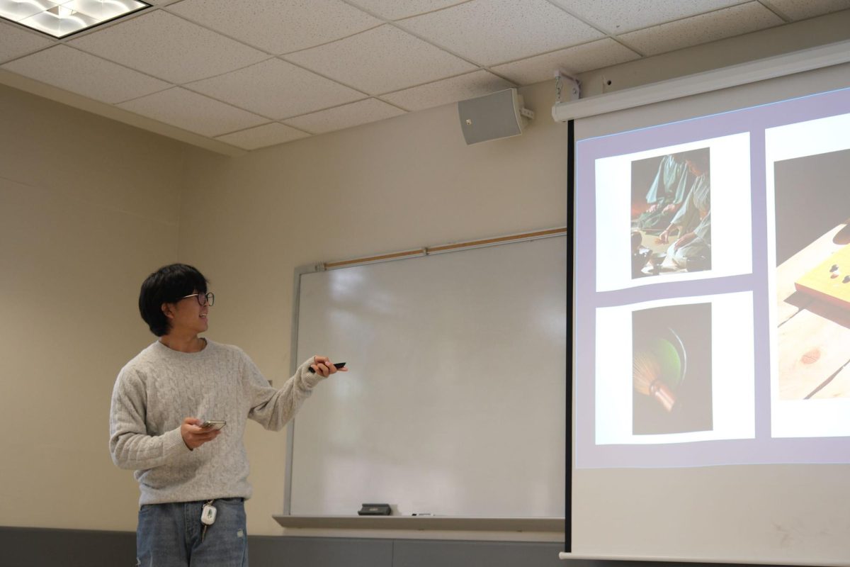A student gives their final presentation in a classroom in Burk Hall on Tuesday, Dec. 5, 2023 at 10:10 am. Classes that are being held can be heard throughout the hallways due to other classes being cancelled. (Andrew Fogel / Golden Gate Xpress)