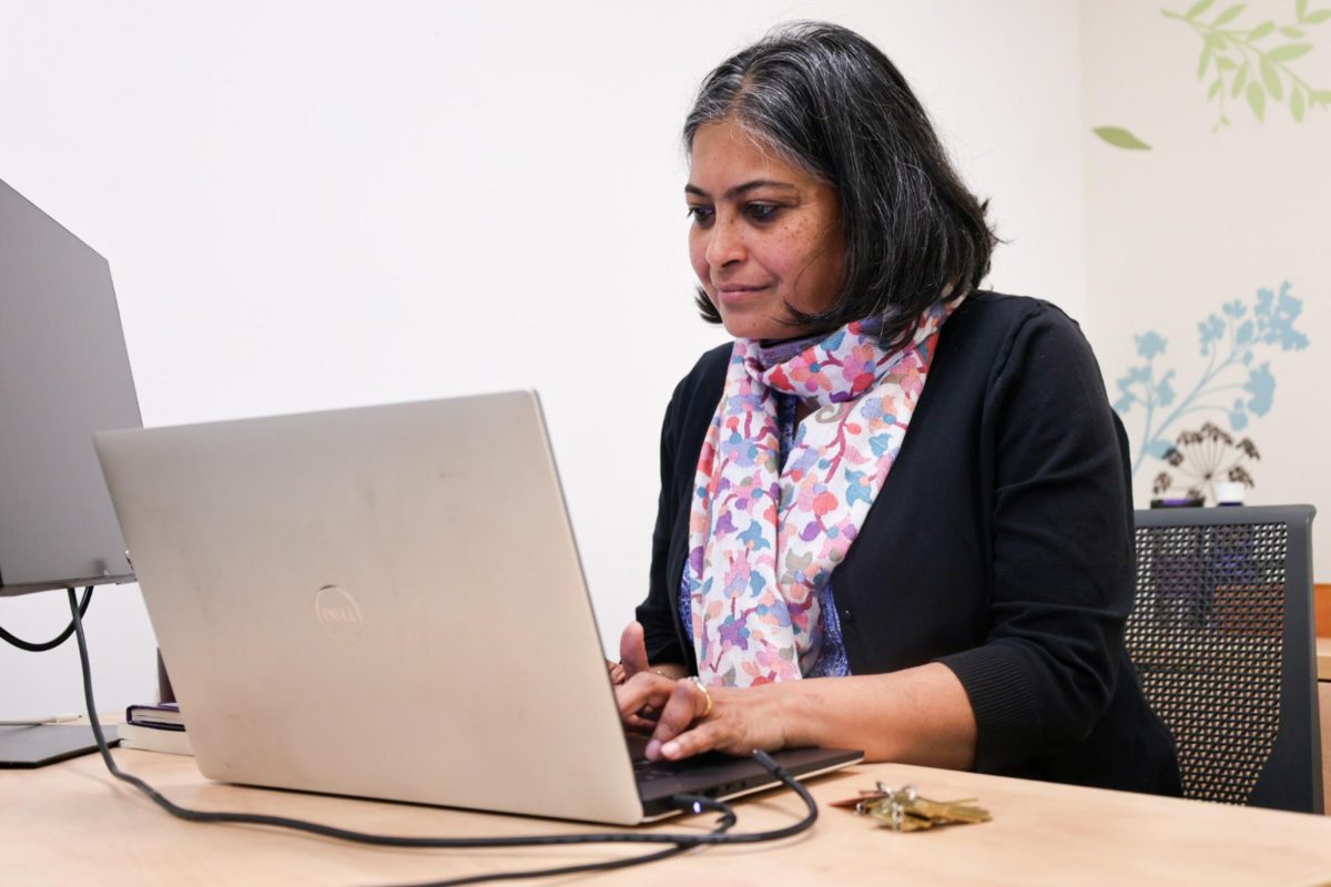 Anoshua Chaudhuri, Director of The Center for Equity and Excellence in Teaching and Learning (CEETL) prepares and gathers notes for the upcoming tasks in her office, on Dec. 3, 2023. (Feven Mamo/ Golden Gate Xpress)