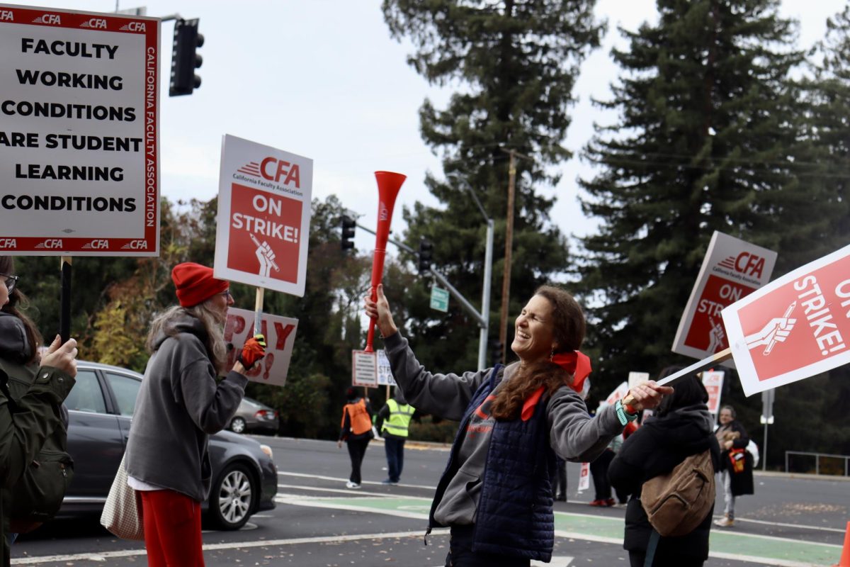 Picketers at an intersection at Sacramento State University on Dec. 7, 2023. (Adriana Hernandez/Golden Gate Xpress)