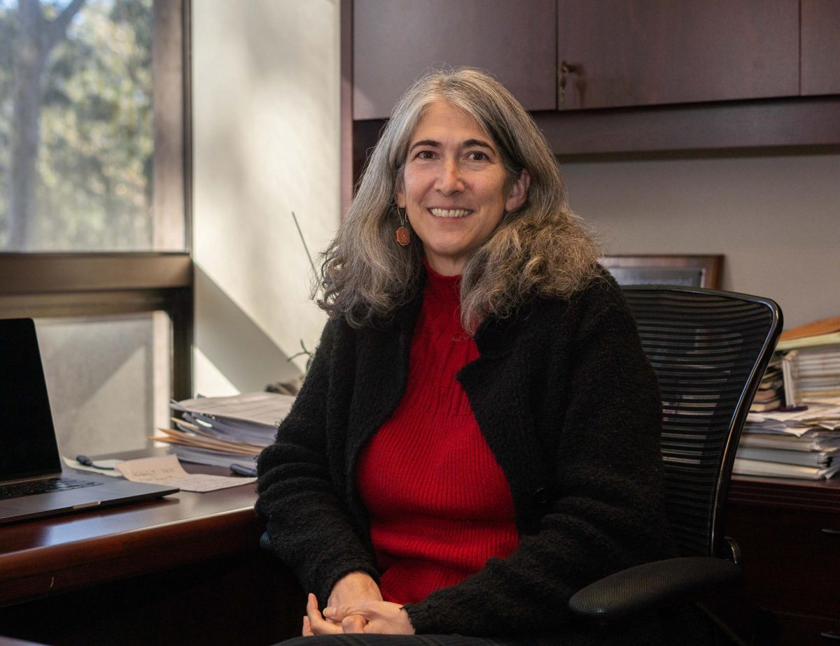 Carmen Domingo, decana de la Facultad de Ciencias e Ingeniería, sentada en su oficina el 1 de diciembre de 2023. (Daniel Hernandez/ Golden Gate Xpress)
