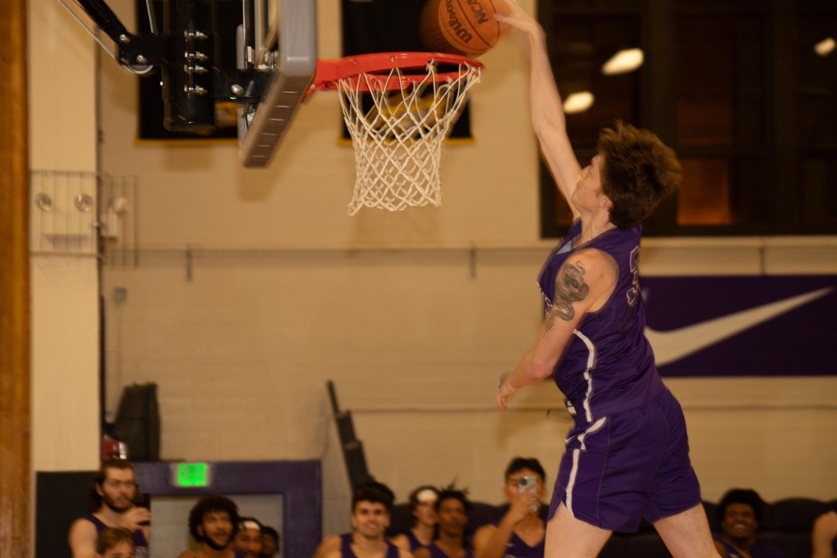 Alec Smith dunks a one-handed during the dunk contest. Nov. 13, 2023. (Colin Flynn/Golden Gate Xpress)

