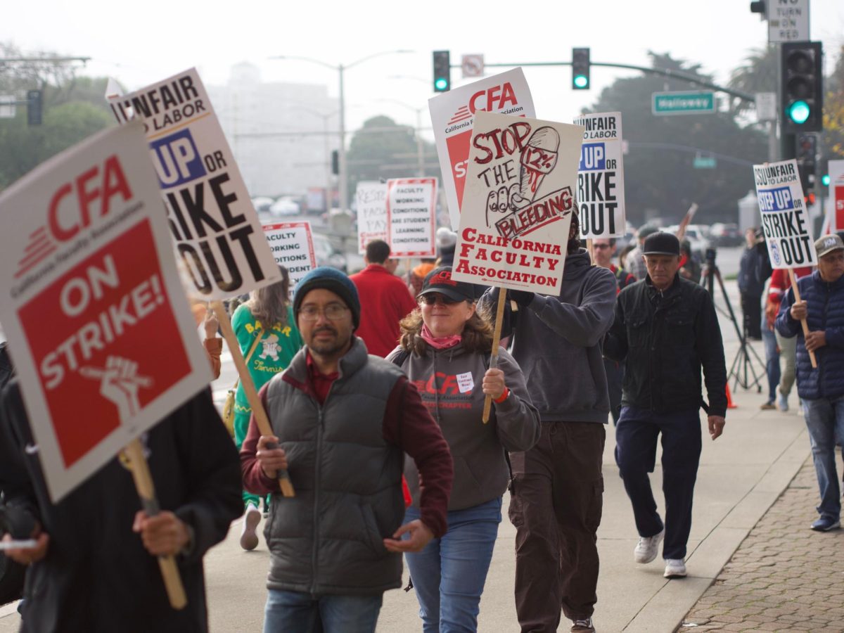 CFA picketers march near the 16th and Holloway during the one-day rolling strike at San Francisco State University on Dec. 5, 2023.