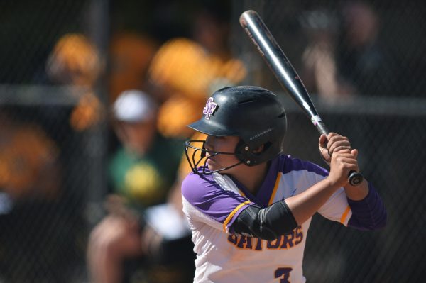 Kai DeLeon bats during the first game of the doubleheader against the Cal Poly Humboldt Lumberjacks at the SFSU softball field on March 15, 2024. DeLeon is second on the team in hits, and third in batting average, and would record a hit in each game of the doubleheader. (Andrew Fogel / Golden Gate Xpress)