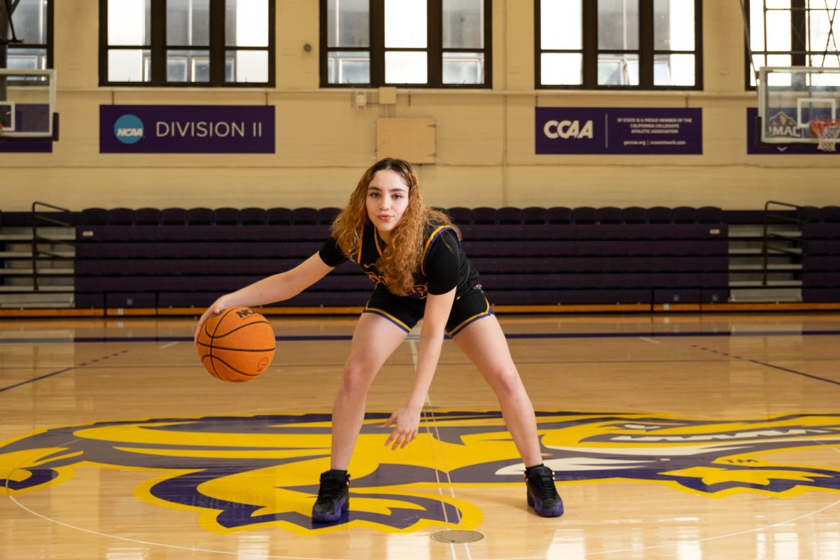 Alley Alvarado, a guard for the SFSU women’s basketball team, poses for a portrait in the Gymnasium on Wednesday, March 13, 2024. (Andrew Fogel / Golden Gate Xpress)