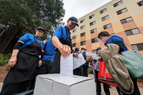 A City Eats employee votes on the decision to ratify a new wage contract near Mary Ward Hall on April 3, 2024. (Neal Wong / Golden Gate Xpress)