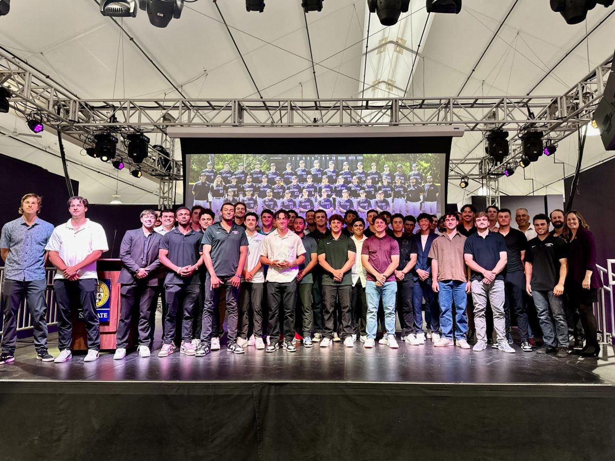 The SFSU baseball team stands along the stage next to members of Athletics at the Athletes Banquet in Annex I on May 13, 2024. (Jake Knoeller / Golden Gate Xpress)