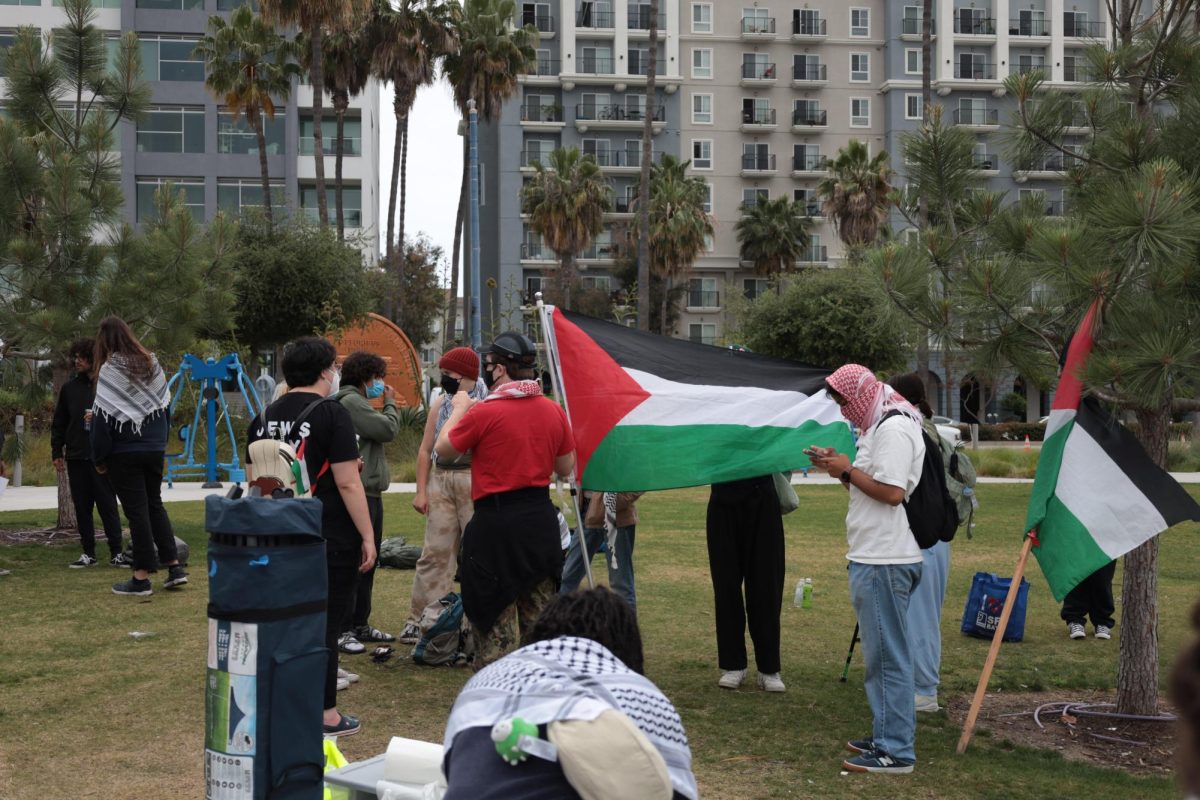Students for Gaza SFSU and other rally attendees gather at Lincoln Park in Long Beach on May 21, 2024. (Cami Dominguez / Golden Gate Xpress)