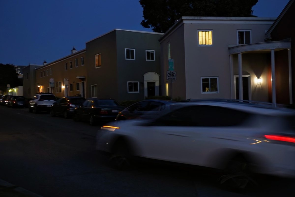 A car heads east on Holloway Avenue with buildings in University Park South in the background on Wednesday, May 1, 2024. (Neal Wong / Golden Gate Xpress)