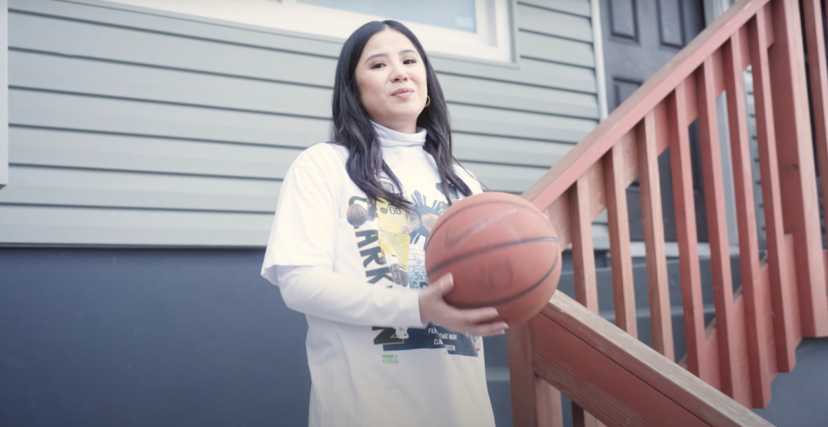 Ashley Romero, the director and writer of the film, holds a basketball during the movie trailer (Courtesy of Ashley Romero)