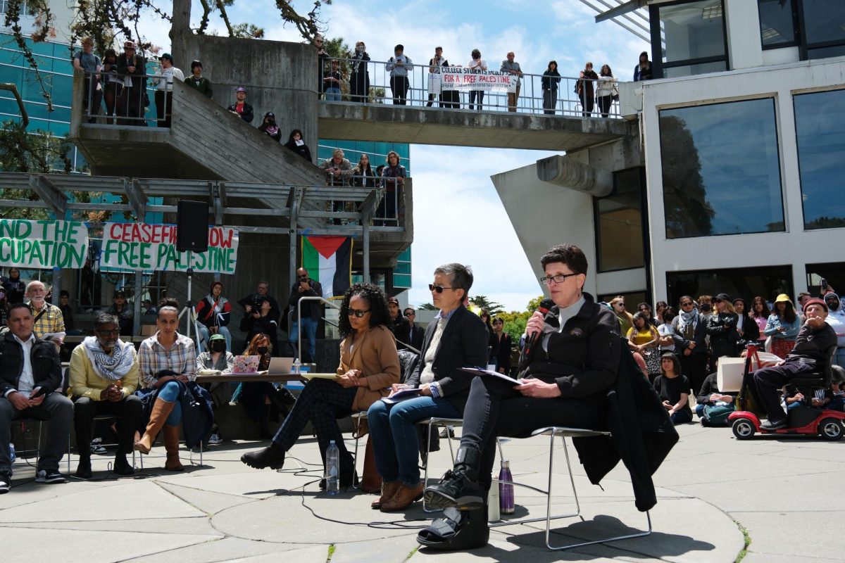 SFSU President Lynn Mahoney speaks during an open bargaining session with members of a pro-Palestinian encampment on May 6, 2024. Mahoney sat alongside Jamillah Moore, SFSU vice president of student affairs and engagement, and Amy Sueyoshi, SFSU provost. (Andrew Fogel / Golden Gate Xpress)