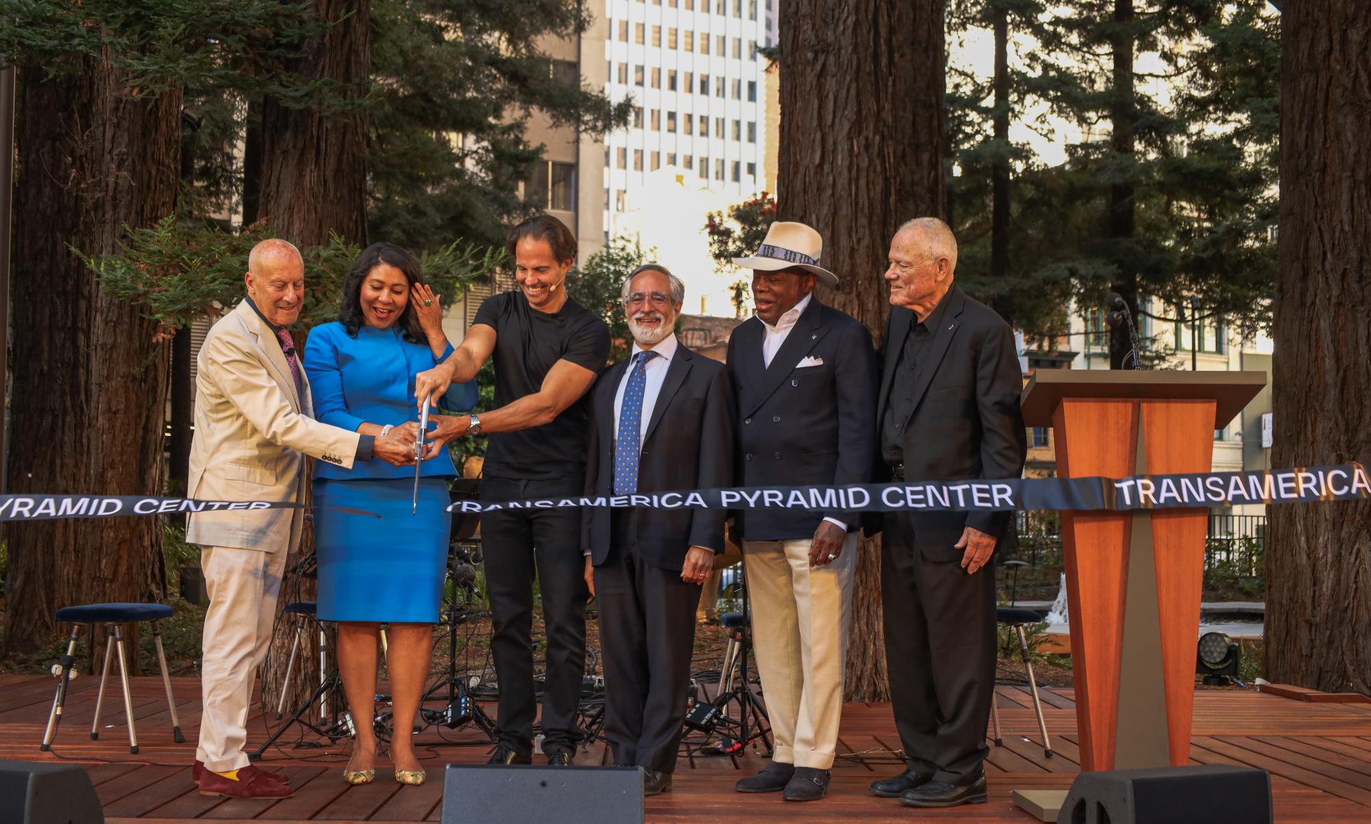 (L-R) Norman Foster, whose architecture firm renovated the building, San Francisco Mayor London Breed, real estate developer Michael Shvo, District 3 Supervisor Aaron Peskin, former SF Mayor Willie Brown and John Krizek, who was in charge of the burial of the time capsule, cut the ribbon at the ceremony for the renovated Transamerica Pyramid on Thursday, Sept. 12, 2024. (Gabriel Carver / Golden Gate Xpress)