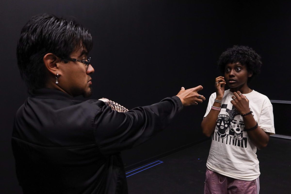 Sal Hernandez and Ti Secrease rehearse a scene from the play “Everybody” where Death comes to pick the character named Everybody. (Gabriel Carver / Golden Gate Xpress)