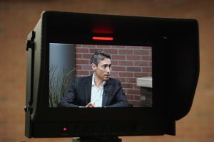 Whit Johnson, a San Francisco State alum and anchor for ABC World News and Good Morning America, is seen on a camera screen in Studio 3 of Marcus Hall on Tuesday, Oct. 1, 2024. (Neal Wong / Golden Gate Xpress)