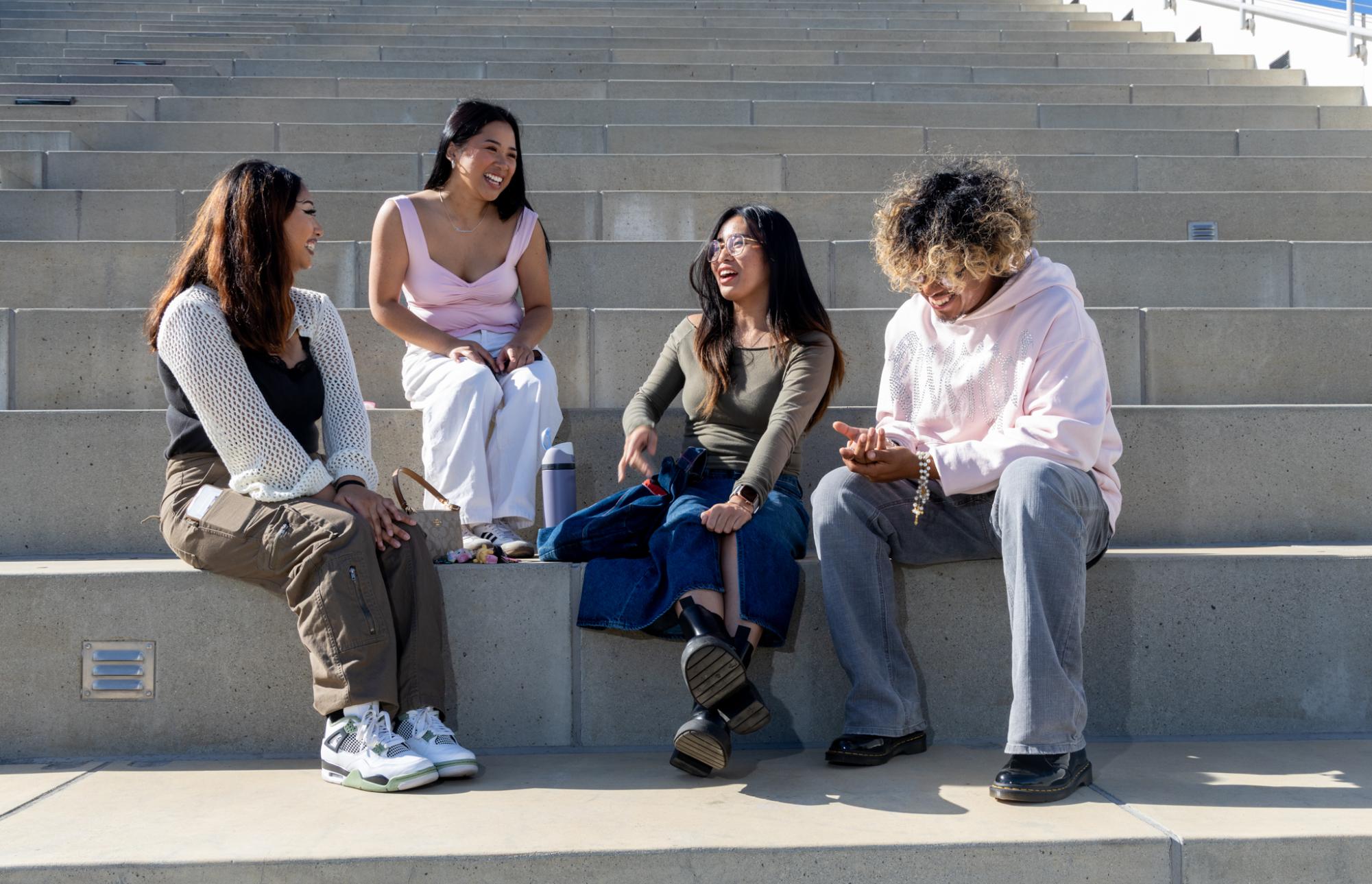 (L-R) Alison Balingit, Marianne Manalo, Samantha Fabie and Alex Solorio chat among each other on top of the Cesar Chavez Student Center on Friday, Oct. 25, 2024. (Dan Hernandez / Golden Gate Xpress)