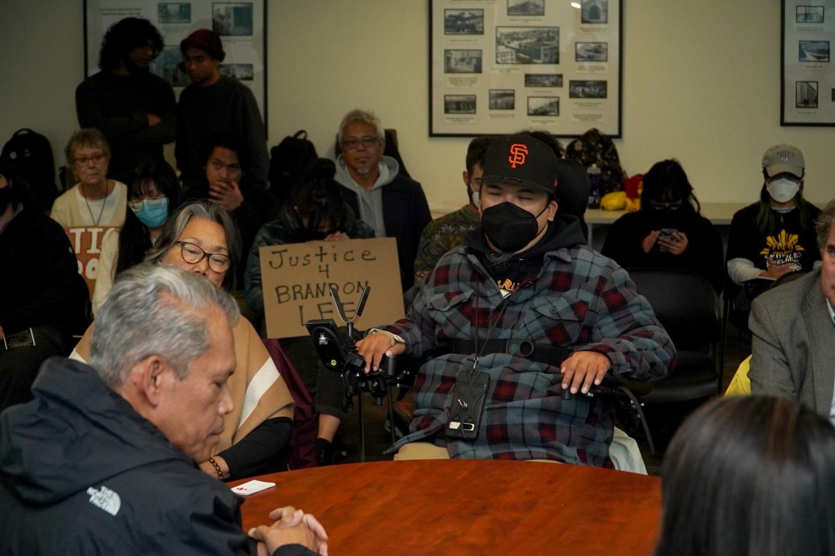 Pam Tau Lee from the International Council on Human Rights in the Philippines and Brandon Lee are seated facing Philippines Consul General Neil Frank R. Ferrer at the Justice4Brandon event in LIB 286 on Wednesday, Nov. 20, 2024. (Neal Wong / Golden Gate Xpress)