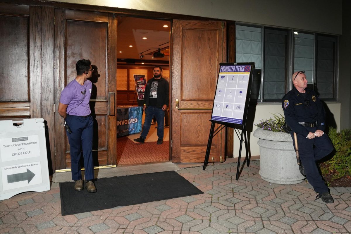  People including SFSU event coordinators, Turning Point USA SFSU chapter volunteers and university police are seen at the Seven Hills Conference Center on Tuesday, Nov. 12, 2024. UPD was seen guarding entrances around the building and walking inside Mary Ward Hall. (Andrew Fogel / Golden Gate Xpress)