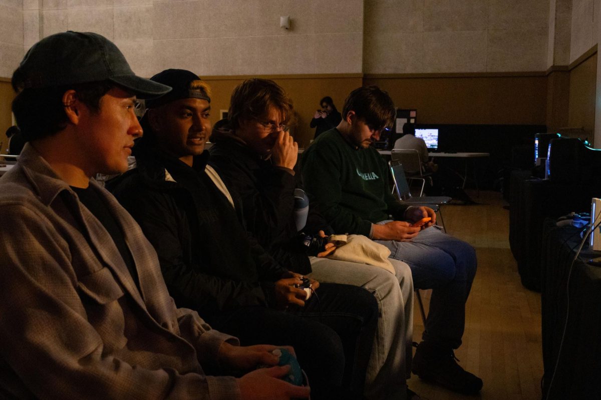 (L-R) Ricky Hernandez, aka “Cera”; Homum Ahsan, aka” MUMZY”; Josh Aubin aka” Mongoose”; and Max Gilchrist aka “RF20,” play Super Smash Bros. Melee at SF Rec and Tech on Nov. 22, 2024. (Jesus Arriaga / Golden Gate Xpress)