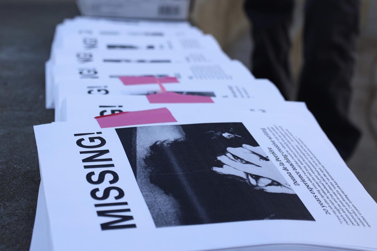 A stack of “missing” persons posters in Malcolm X Plaza on Wednesday, Dec. 4, 2024. (Gabriel Carver / Golden Gate Xpress)