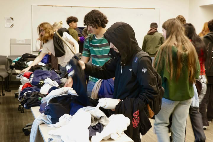 People look through clothes at the Alli Gator’s closet event on Thursday, Dec. 5, 2024. (Courtesy of Campus Recreation)