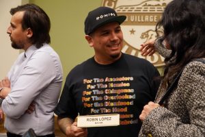 Robin López greets a friend while posing for photos in the City Hall of Albany, Calif. on Monday, Dec. 9, 2024. (Neal Wong / Golden Gate Xpress)