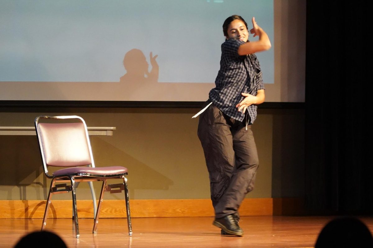 Olivienne Beard dances to “Paint the Town” by LOONA during the Asian Student Union Talent Show in Jack Adams Hall on Dec. 6, 2024. (Neal Wong / Golden Gate Xpress)