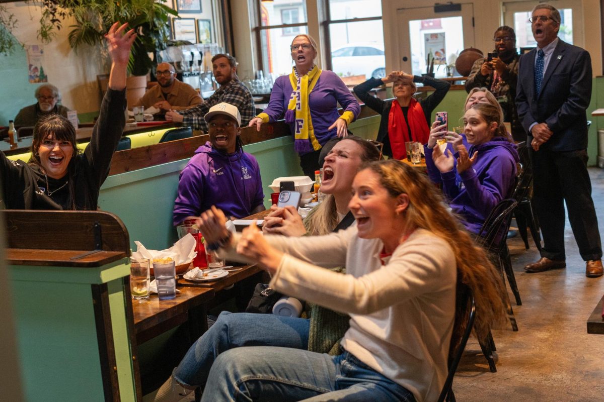 Fans react as the San Francisco State University’s women’s volleyball team defeats the University of Central Oklahoma in the NCAA Division II Women’s Volleyball Tournament in Sioux Falls, South Dakota on Thursday, Dec. 12, 2024. (Sean Young / Golden Gate Xpress)