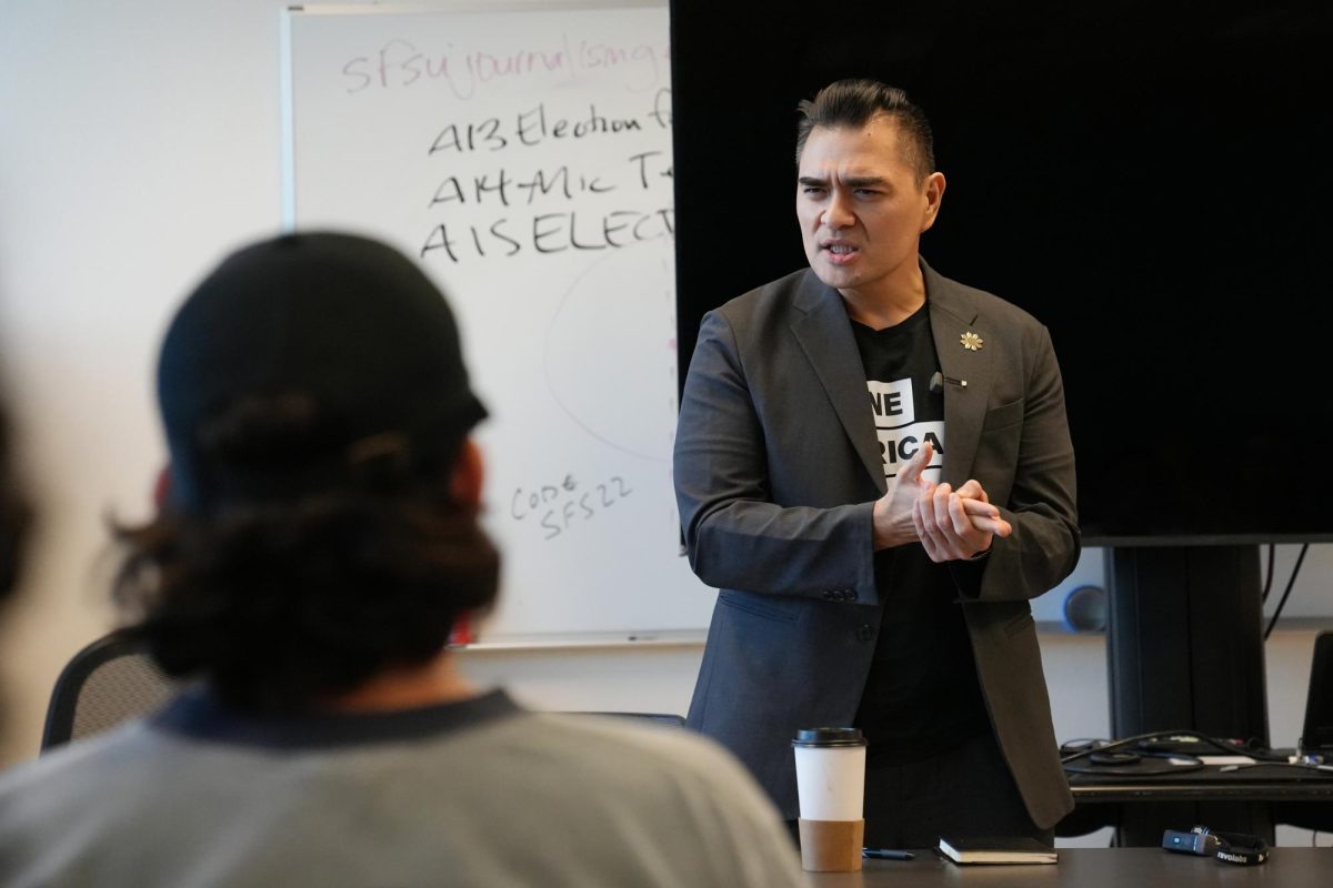 Jose Antonio Vargas, a journalist and CSU Trustees, speaks at an open forum event in Humanities Building Room 309 on Wednesday, Dec. 4, 2024 (Andrew Fogel / Golden Gate Xpress)