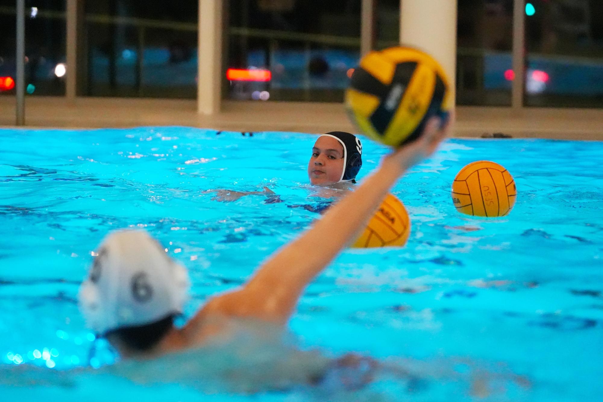  Members of the water polo club practice in the Mashouf Wellness Center on Tuesday, Dec. 3, 2024. (Andrew Fogel / Golden Gate Xpress)