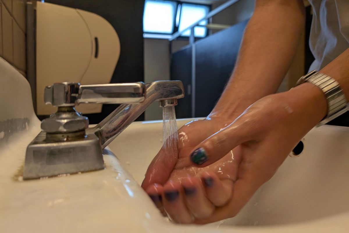 A student washes his hands in a restroom on campus on Thursday, Jan. 30, 2024. (Neal Wong / Golden Gate Xpress)
