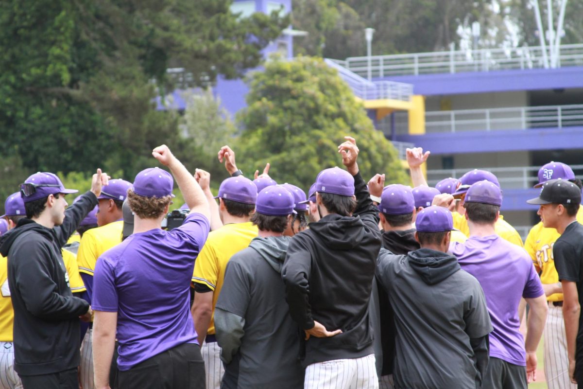 Gator baseball players raise their hands and chant in a huddle before their final home game at Maloney Field on April 27, 2025. 