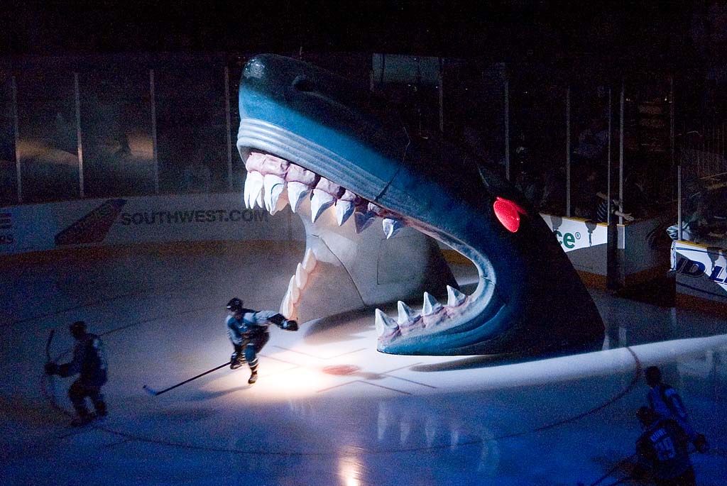 San Jose Sharks players skate onto the ice from through the shark head before a game against the Columbus Blue Jackets at the HP Pavillion, now the SAP Center, in San Jose on March 16, 2007. (Elliot on Flickr, Wikimedia Commons)