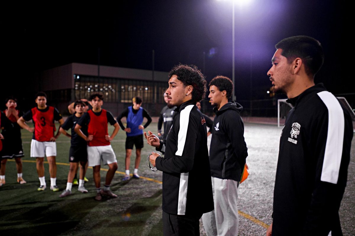 San Francisco State University men’s club soccer officers Uilliam Garduno, Sage Urbaez and Daniel Rodriguez address tryout attendees after their evening tryouts at the Mashouf Wellness Center field on Thursday, Feb. 5, 2026. (Vanden Harris / Golden Gate Xpress)