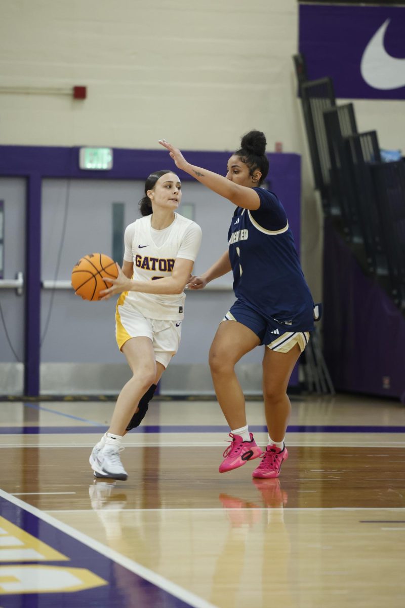 San Francisco State University’s Gianna Darté scans the court for a teammate while being defended in a home game versus the University of California, Merced Bobcats on Thursday, Feb. 26, 2026. (Golden Gate Xpress / 
