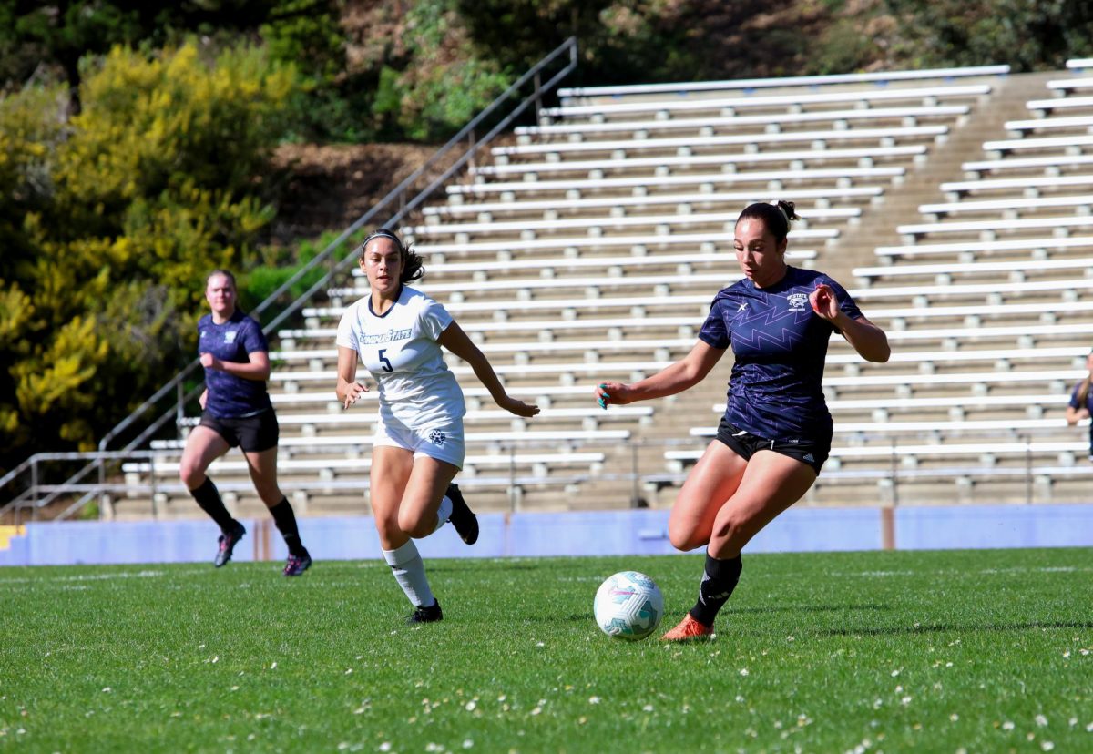 San Francisco State University’s women’s club soccer captain Charlie Thelen dribbles the ball during her game against Sonoma State University at Cox Stadium on Saturday, Feb. 21, 2026. (Gwen Murray / Golden Gate Xpress)