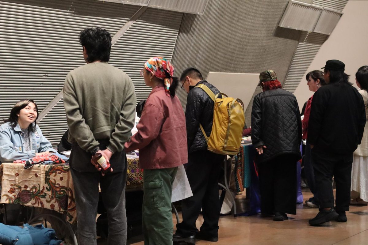 Audience members interact with the League of Filipino Students, Gabriela and other local Filipino organizations tabling at the 2026 Philippines Report Back event on Thursday, March 5, 2026. 