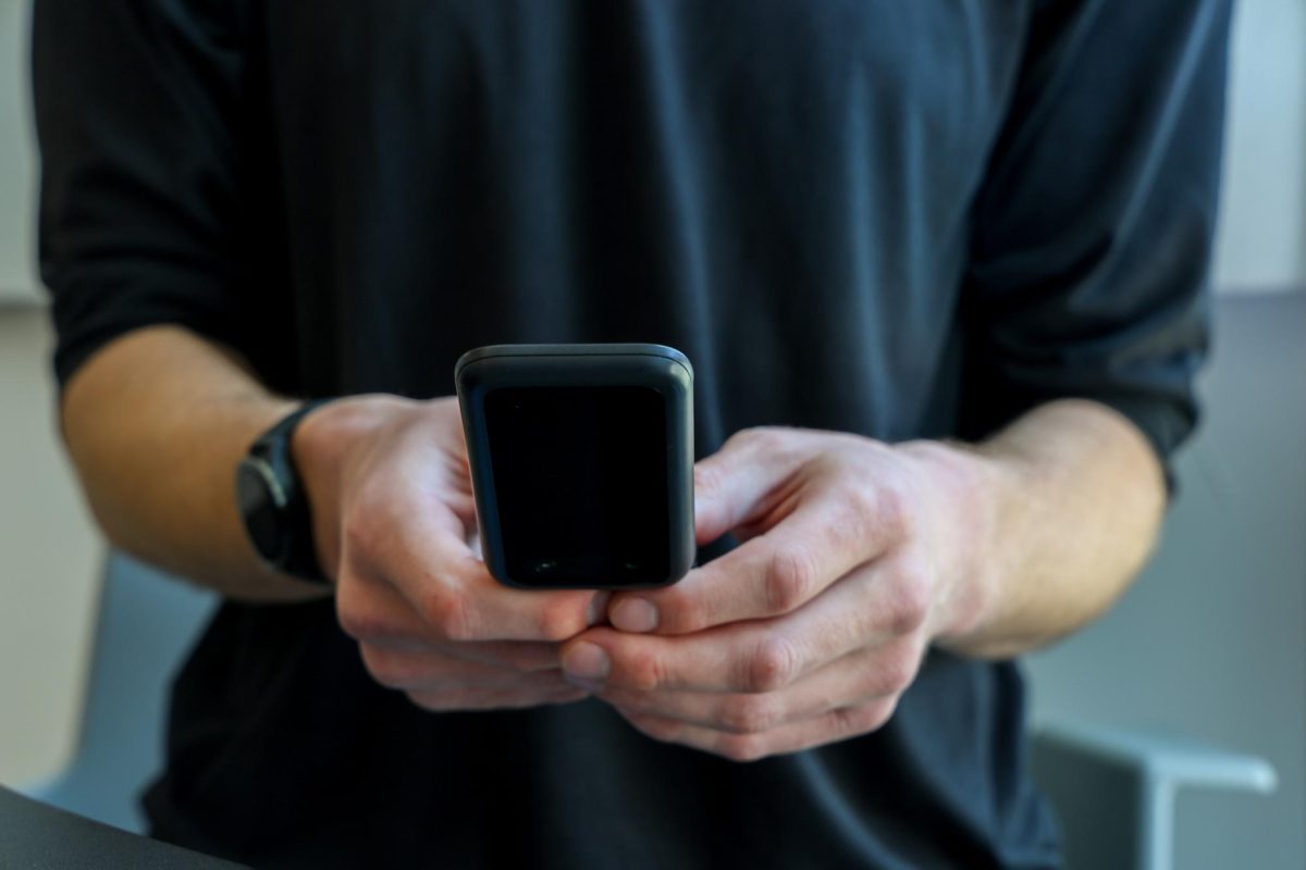 Jackson Everett sends a text message to a friend in Marcus Hall on May 6, 2026. (Haley Abarca / Golden Gate Xpress)