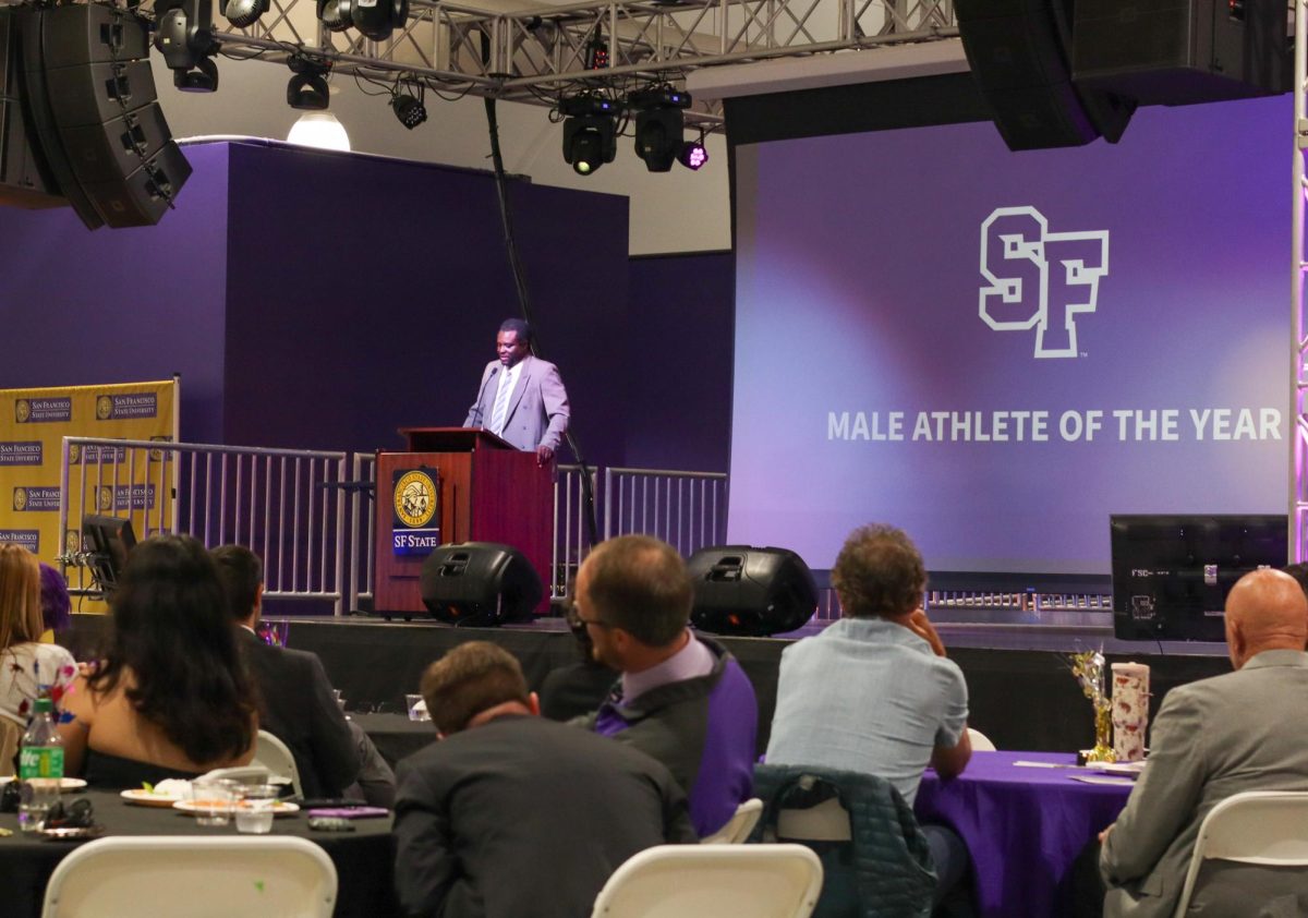 Gameday Management Coordinator Jamil Sheared prepares to announce the Men’s Athlete of the Year award at the annual Student-Athlete Awards Banquet in Annex 1 on May 11, 2026. (Eliza Arthur / Golden Gate Xpress)